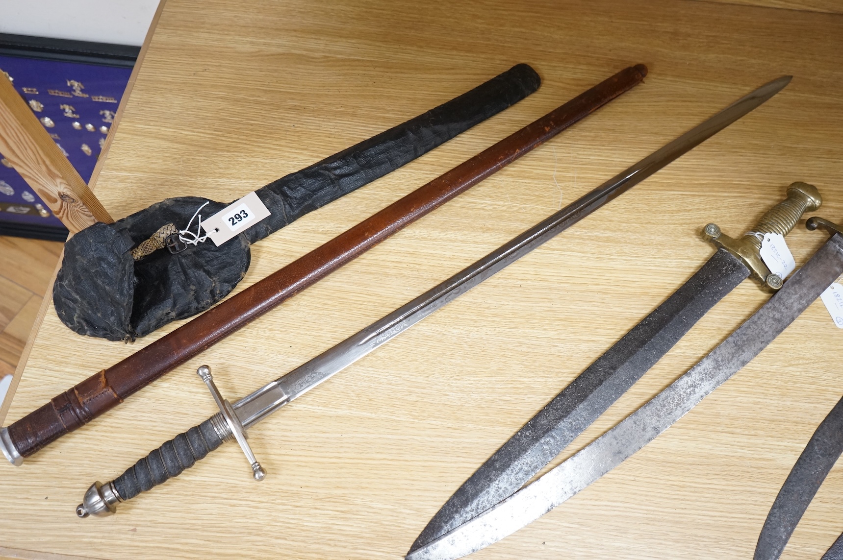 World War I Scottish infantry officer’s undress sword, etched and polished regulation blade with crowned GVR cipher and regulation cruciform hilt, in its leather scabbard